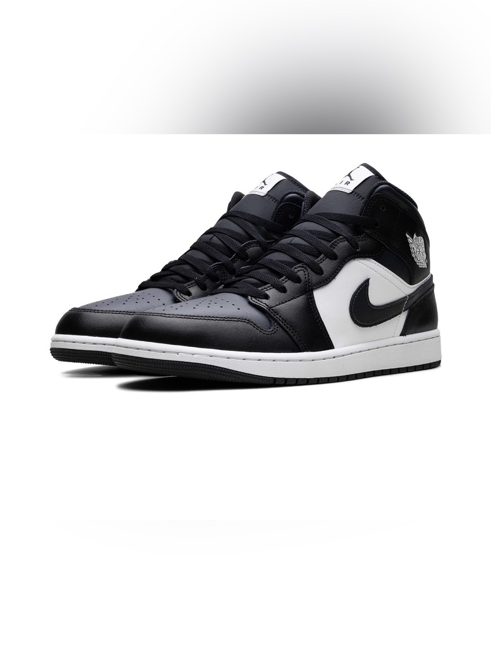 Jordan Black and White Mid-Top Sneakers